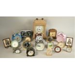 A large collection of mantle, wall, and travel alarm clocks. (3)