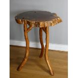 An occasional table made from a walnut tree stump, 52cm diameter.