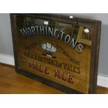 An oak framed pub mirror advertising 'Worthington's Pale Ale' 92 x 67cm, together with a pine framed