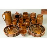 A collection of Studio Pottery glazed terracotta kitchen ware to include, lidded storage jars,