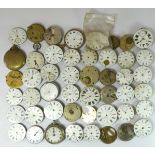 A collection of pocket watch movements and dials