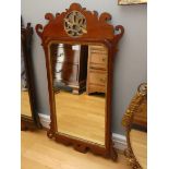 A Victorian mahogany wall mirror, with shaped fretwork frame, carved gilded gessoed slip and a