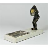 A mid Century cold painted bronze figure of a goblin/elf on a marble base, incorporating a silver