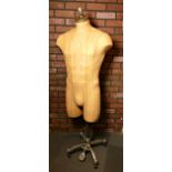 A mid Century 3/4 male bust mannequin by Fusion USA, on a cast metal adjustable stand.