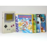 A Nintendo Gameboy, with four boxed games including MegaMan II, Rad'n'Bad, Simpsons - Escape from