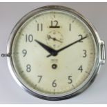 A Smiths Empire chrome bulkhead clock, the 6inch dial, with subsidiary seconds dial, Roman Numerals,