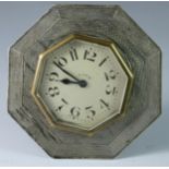 A silver easel desk clock, Chester 1929, of octagonal form with engine turned decoration