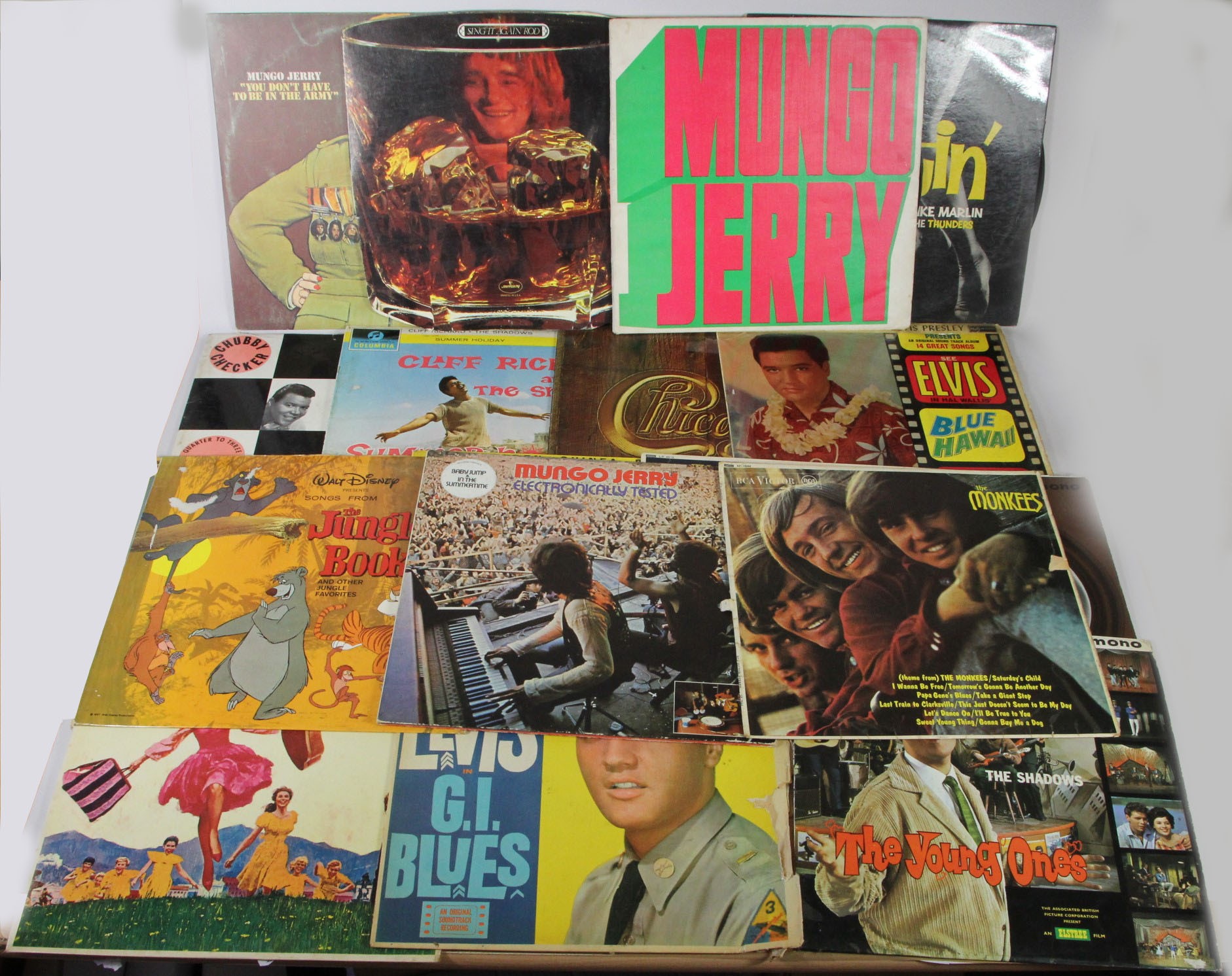 A collection of 11 The Beatles books and a vinyl LP/33 record 'The Beatles Rock 'n' Roll volume 1,