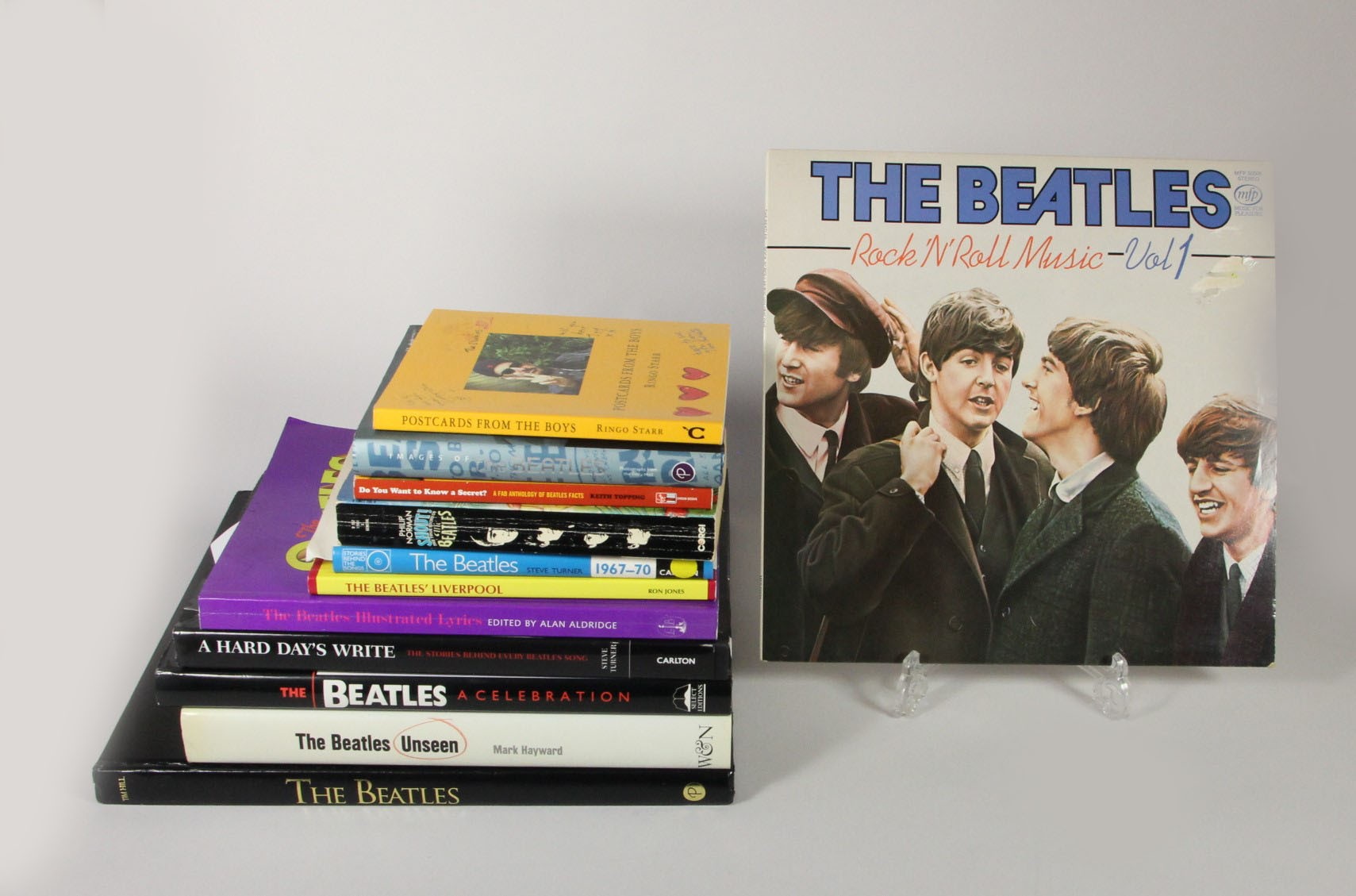 A collection of 11 The Beatles books and a vinyl LP/33 record 'The Beatles Rock 'n' Roll volume 1, - Image 3 of 4