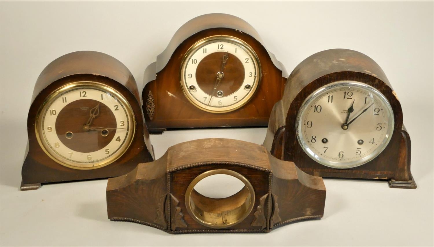 A collection of mid Century mantle clocks and barometers. (2)