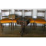A set of four Edwardian mahogany dining chairs, with yellow upholstered padded seats, together