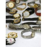 A collection of men's and ladies' quartz watches, also including two watch boxes