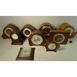 A collection of mid Century oak and mahogany cased mantle clocks. (2)
