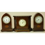 Two mahogany and boxwood inlaid lancet mantel clocks, French movement, and other mantel clock (3)
