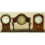 A mahogany mantel clock in the shape of a dressing table, with a curved top and cabriole legs, Swiss