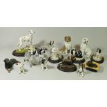 A collection of handcrafted model dogs together with ceramic fruit bowls, glass vases and an early