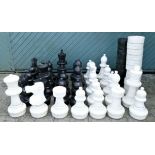 A Rolly Toys giant PVC garden chess and draughts set, lacking one black draught, king 60cm,