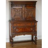 An oak Jacobean style buffet credenza with heavily carved panel doors, 172cm long, 89cm tall, 57cm