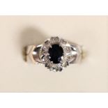 An 18ct white gold sapphire and diamond cluster ring, N 1/2, 4.2gm
