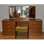 A 1960's 'Cantata Range' dressing table, with triple sectional mirror and six drawers, complete with