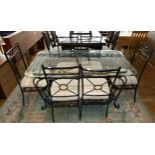 A wrought iron glass top dining table, together with a set of six matching wrought iron dining
