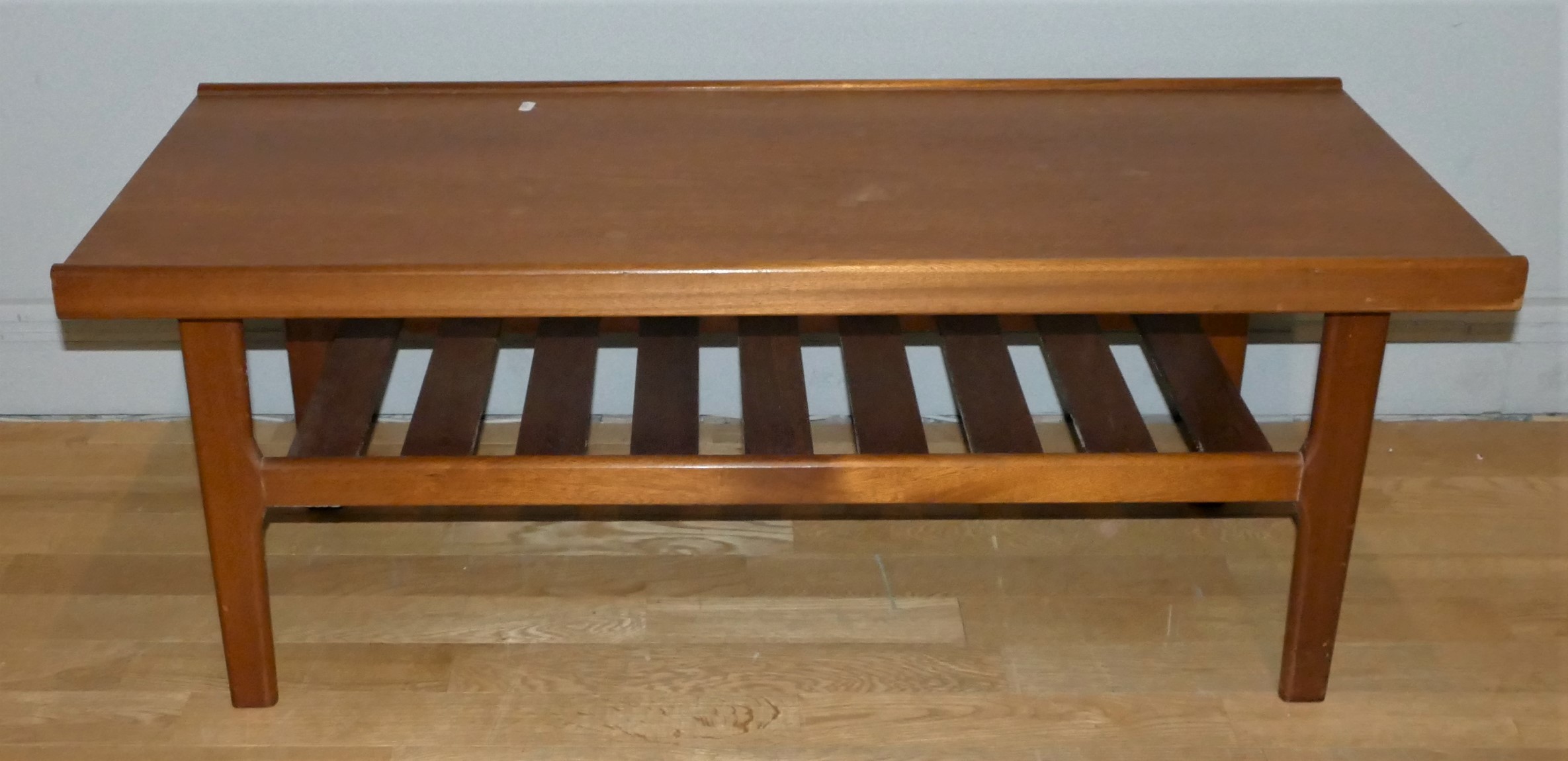 A Mid-Century solid teak coffee table, with slated under shelf, height 45cm, length 110cm