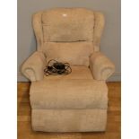 A modern electric recliner armchair, upholstered in a cream patterned fabric. W82, H94cm.