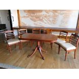 An extending oval dining table (built in leaf) together with a set of six matching dining chairs.