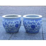 A Chinese pair of blue and white glazed jardinière pots, height 26cm, diameter 30cm.