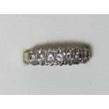A 9ct gold seven brilliant cut diamond ring, stated weight 0.50cts, 9, 2.6gm