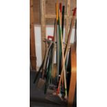 A collection of hand and garden tools, including a hose on reel, a bio-green phoenix heater along