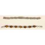 A silver Millennium hallmark panel link bracelet and a silver and tigers eye bracelet, 54gm, case