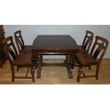 A mid 20th century solid oak draw leaf ding table, together with a set of four matching dining