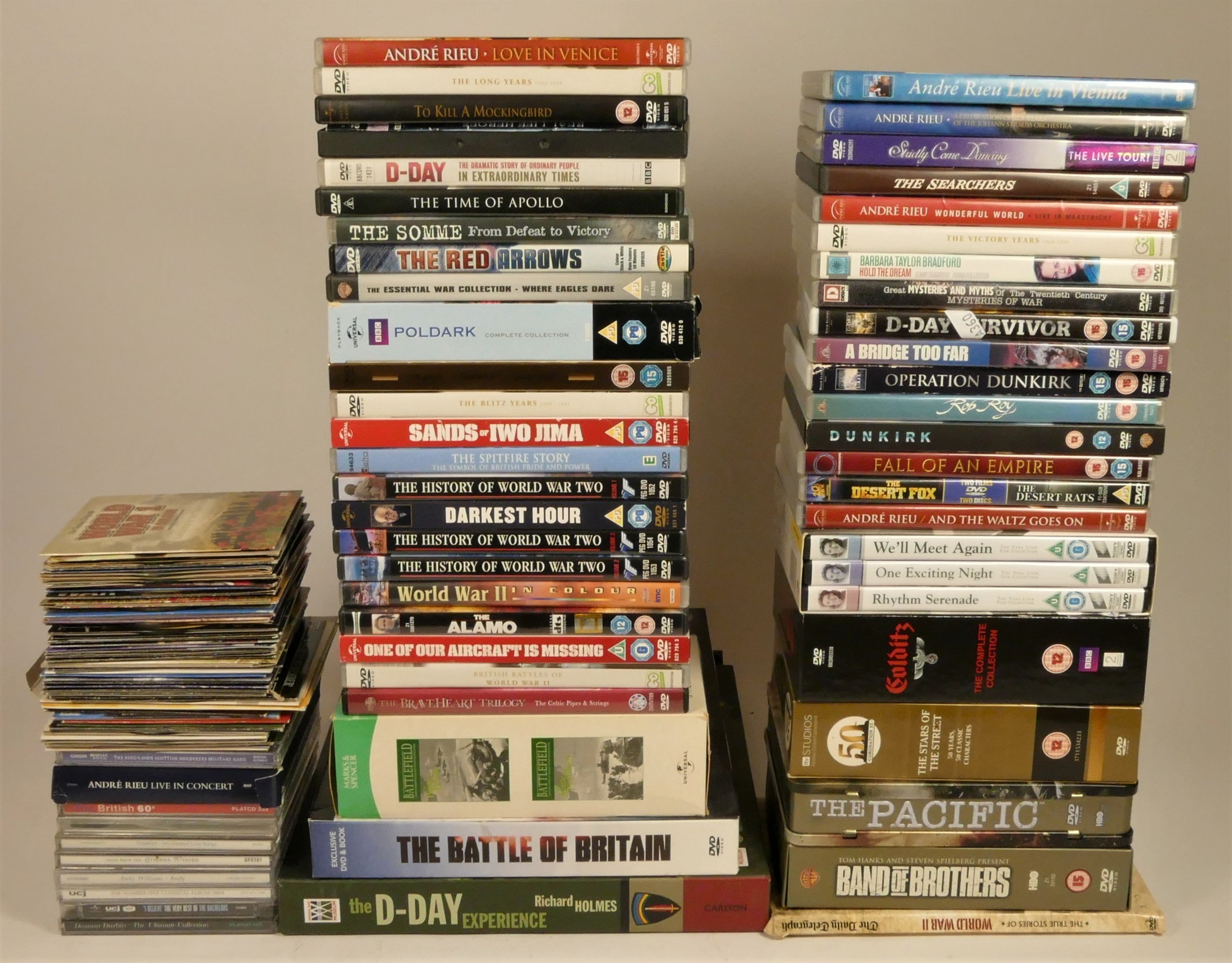 A collection of DVDs including box sets of wartime dramas and documentaries