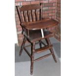 A child's highchair, together with a set of four cast iron Heritage Bathrooms Imperial Bath Feet,