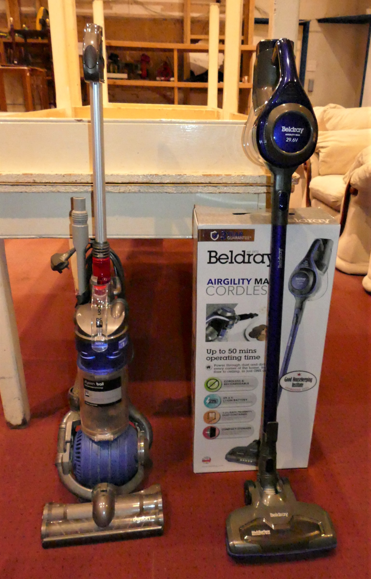 A Beldray Airgility Max cordless vacuum cleaner with box, together with a Dyson Ball vacuum