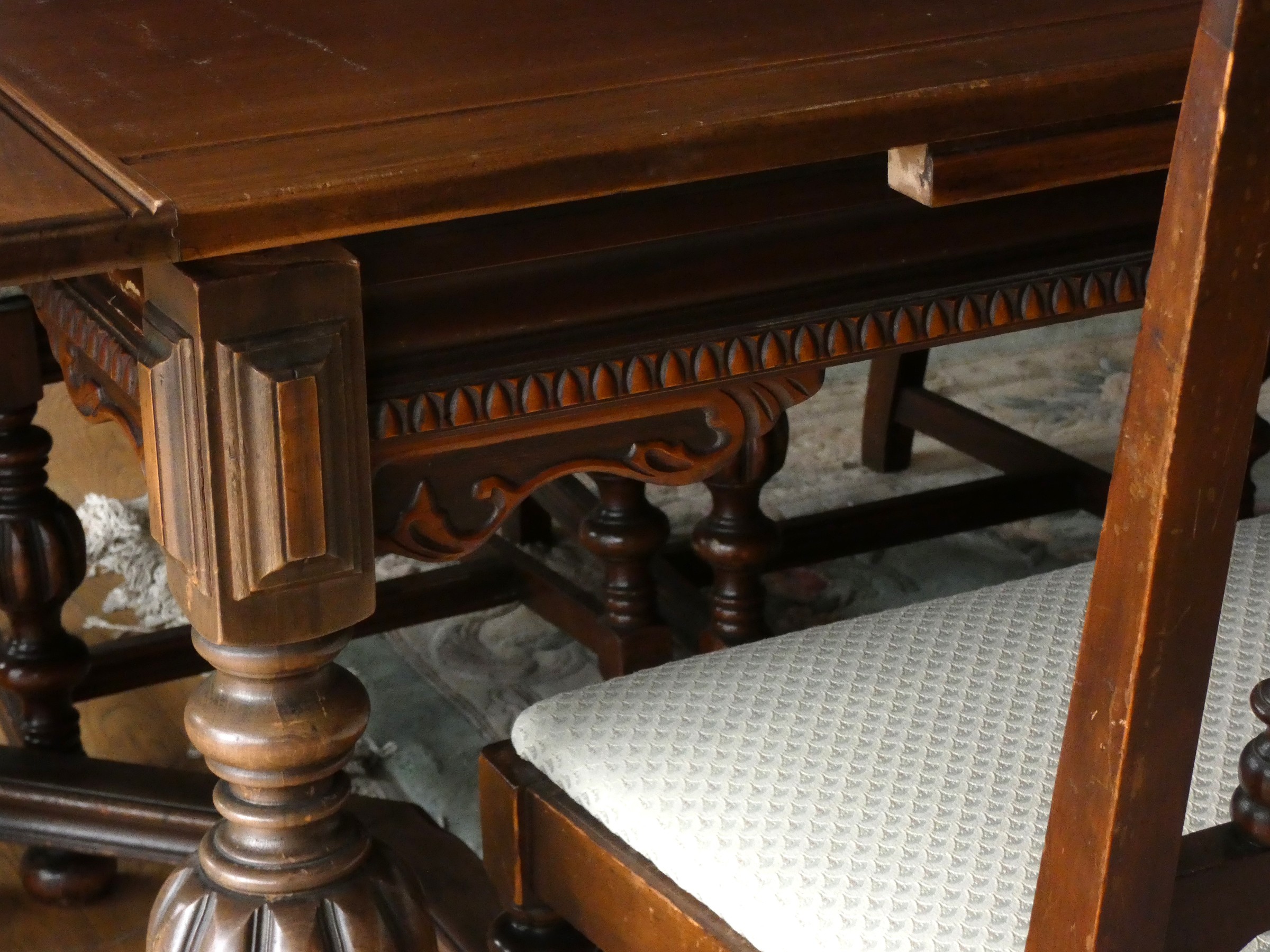 A Jacobean style oak draw leaf dining table raised on turned uprights supported by carved - Image 3 of 10