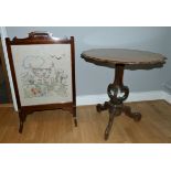 A Victorian mahogany tilt-top trypod table, with scalloped edge top, carved pedestal on scrolled