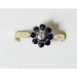 An 18ct gold sapphire and diamond cluster ring, O, 3.5gm