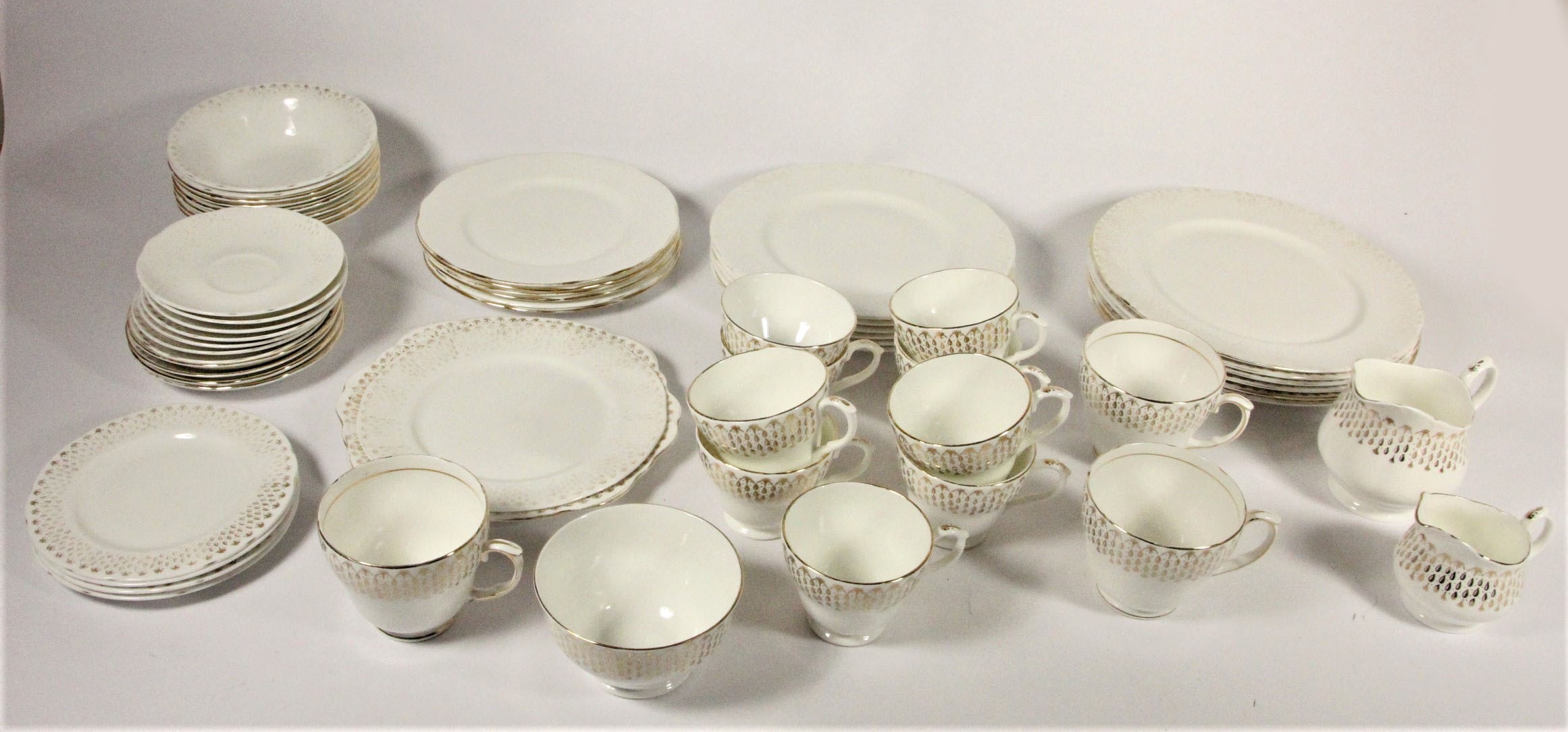 A Duchess 'Raindrop' part dinner service with milk jug and sugar bowl, together with other