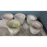 Five composite garden planters, with floral and barrel decoration, 35cm height (5)