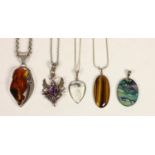 A silver and amethyst scroll pendant, chain, an silver and amber pendant, a silver a tigers eye