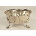 A Victorian silver sugar bowl, London 1891, raised on shell capped feet, diameter 13cm, 200gm