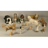 A collection of seventeen various sized mid 20th Century ceramic animal models of dogs, by Studio