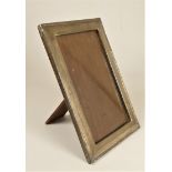 A rectangular silver photograph frame, Birmingham 1907, easel back, 26 x 19cm overall.