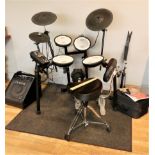 A Roland TD-10 4 piece compact mesh head electronic drum set complete with Roland PM-10 personal