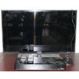 A Samsung UE3D6530 television with remote control, together with a Panasonic DMR-EX97 DVD player,