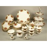 A Royal Albert 'Country Roses' tea/dinner service consisting of a teapot, six cups & saucers, six