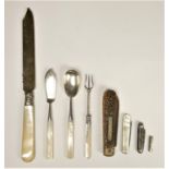 A mother of pearl and silver cake knife, Sheffield 1913, three electroplated serving implements