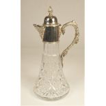 A silver mounted cut glass claret jug, Birmingham 1975, with grape and vine handle, 31cm